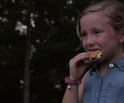 Girl Eating a S'more